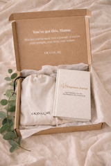 Pregnancy journal set with 'You've got this, Mama' message in a box on a soft fabric background.