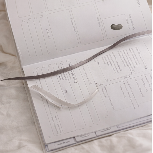 Open book on a beige surface with a blurred background